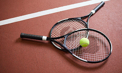Tennis rackets with a ball